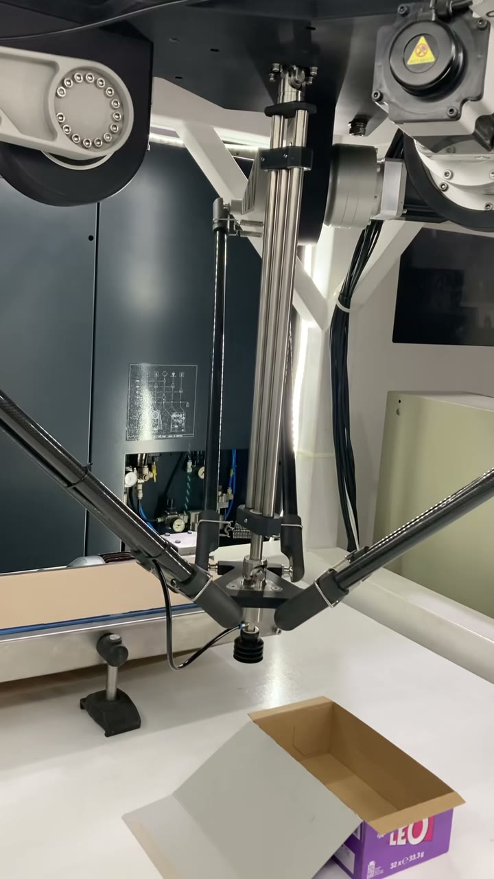 Delta robot placing chocolate bars into a box